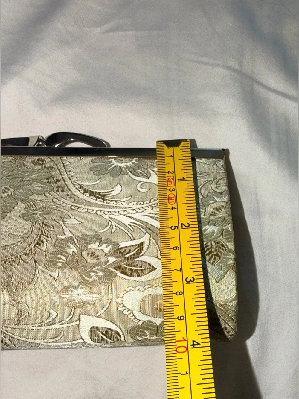 Viintage-style evening clutch features gold/green floral damask metal kiss lock